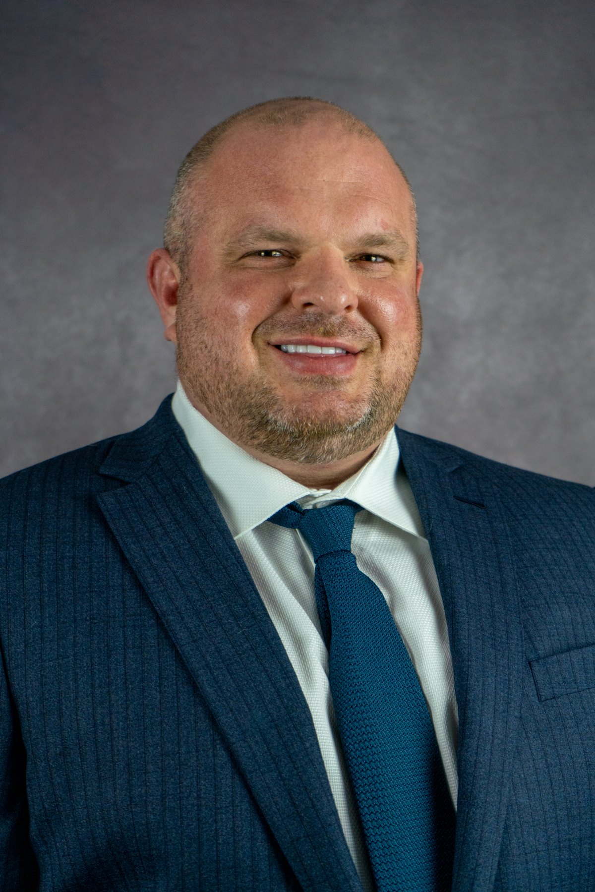 Executive headshot, studio backdrop