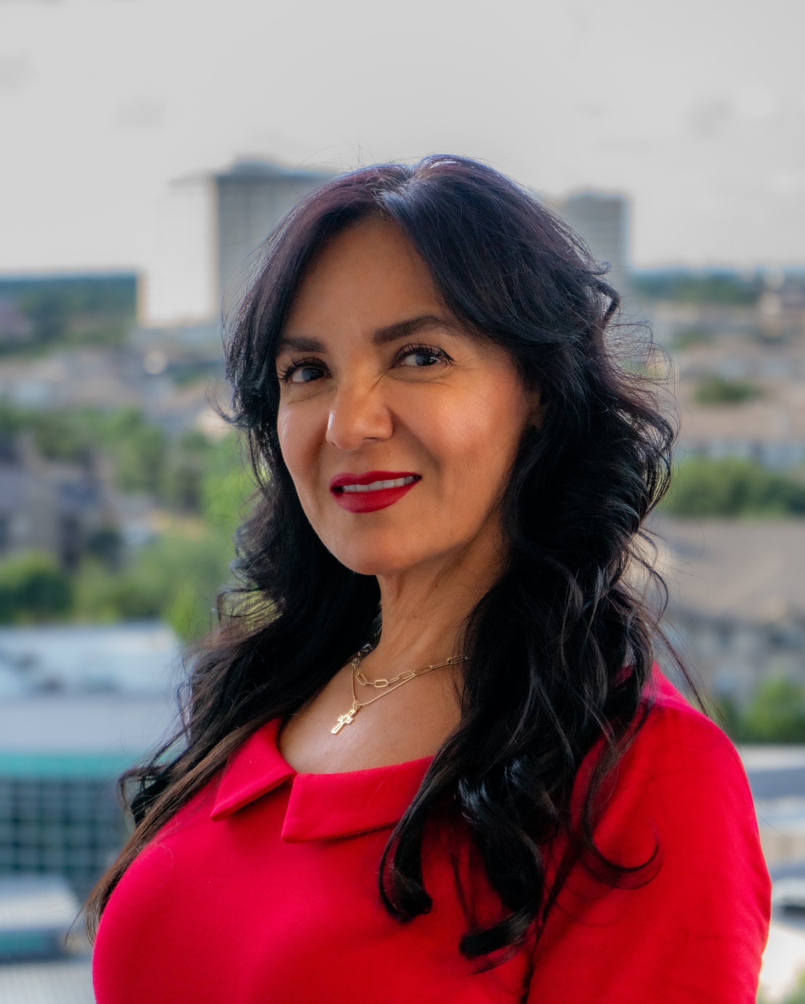 Environmental executive portrait against a city skyline